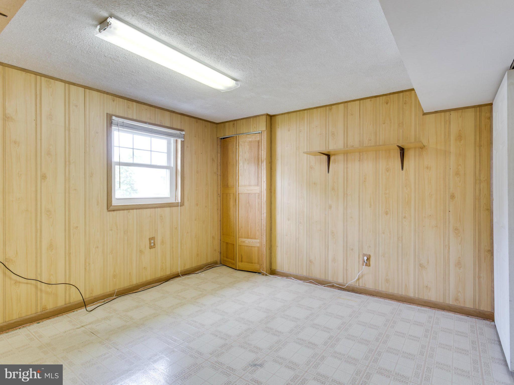 415 Rockway Road Catonsville, MD 21228 - Photo 23 of 30 a view of an empty room with a window
