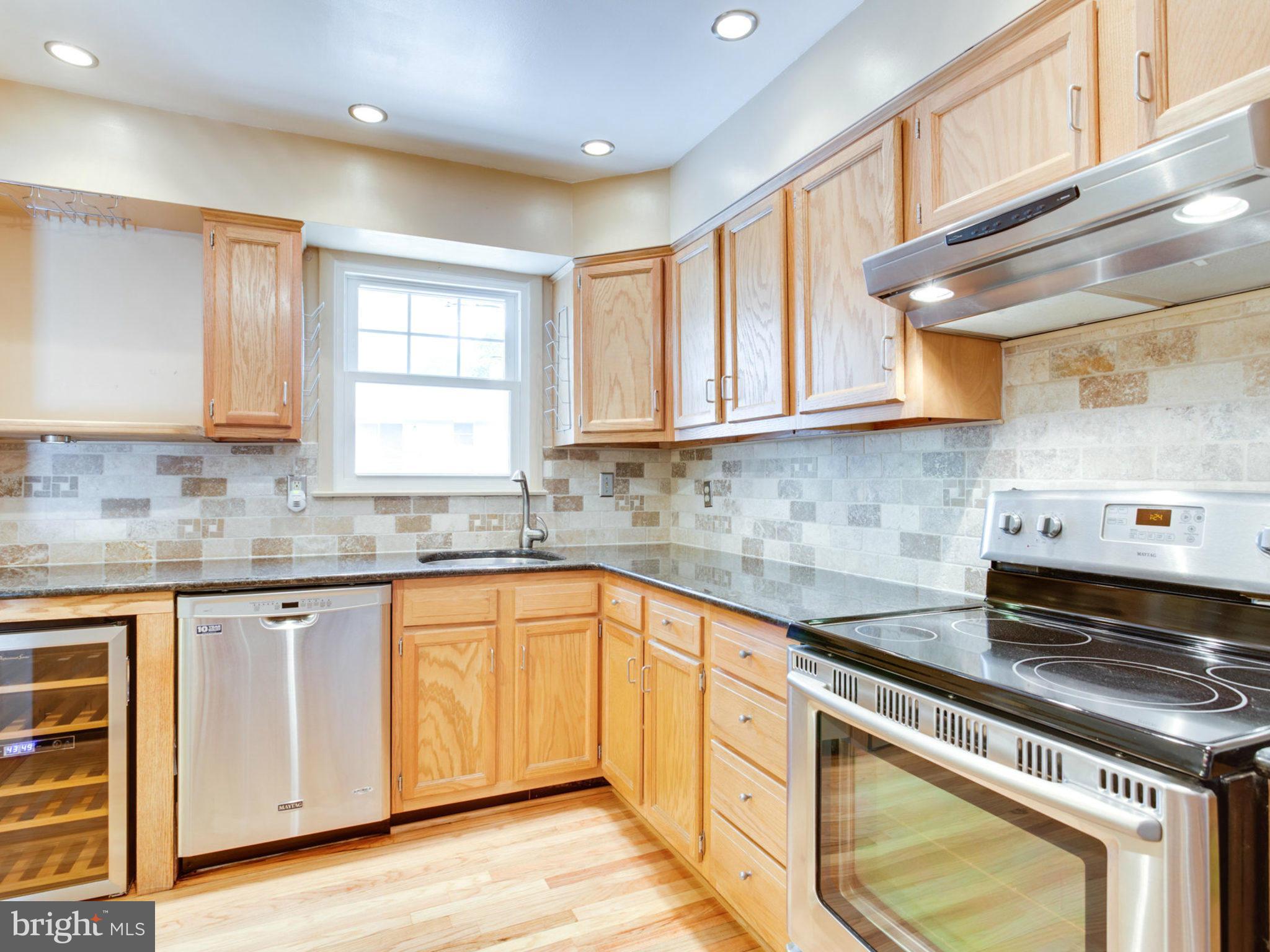 415 Rockway Road Catonsville, MD 21228 - Photo 8 of 30 a kitchen with stainless steel appliances granite countertop a sink and cabinets