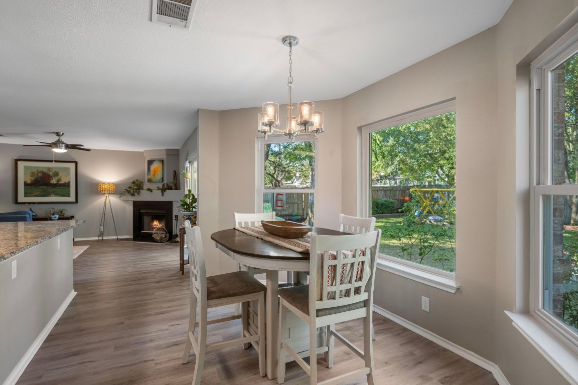 1607 Azalea Drive Cedar Park, TX 78613 - Photo 12 of 40 a view of a dining room with furniture window and wooden floor