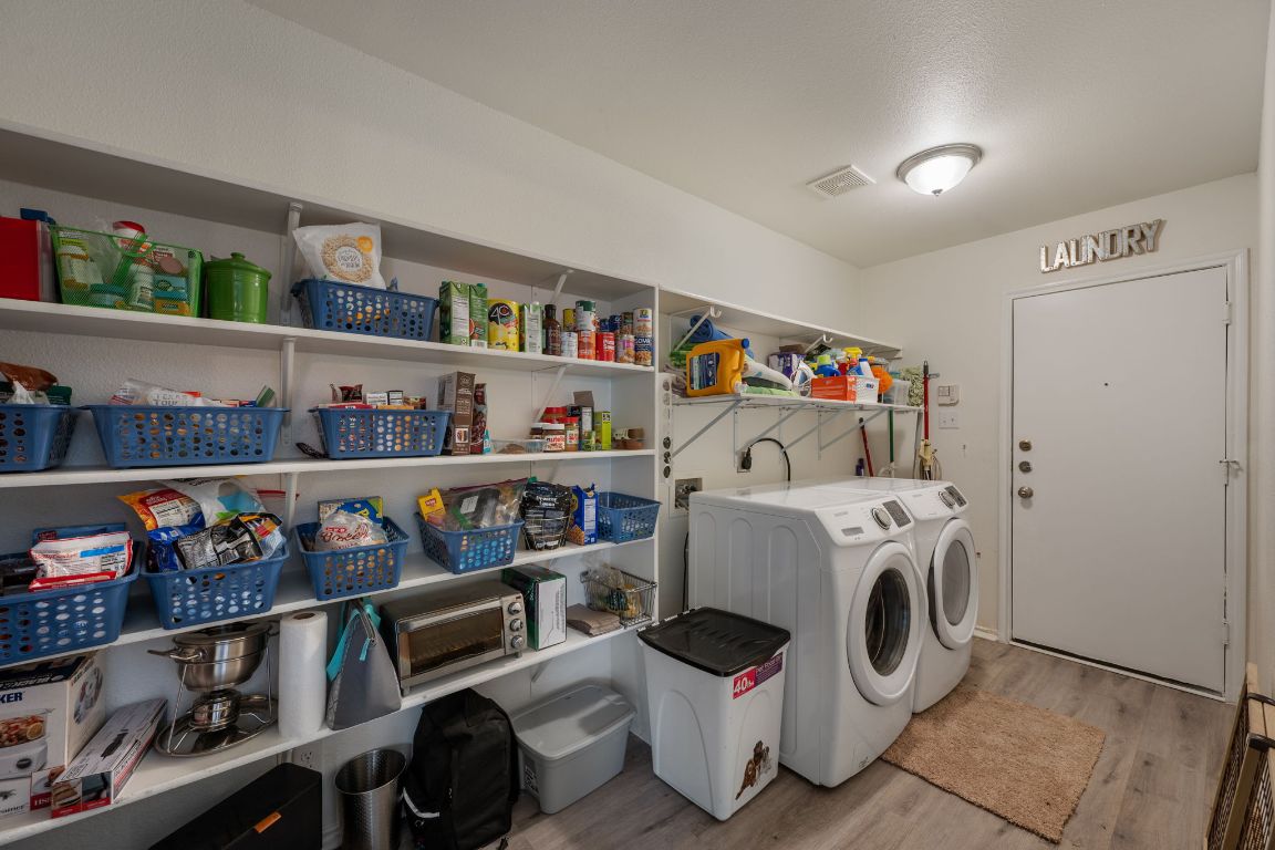 1607 Azalea Drive Cedar Park, TX 78613 - Photo 13 of 40 a utility room with dryer and washer