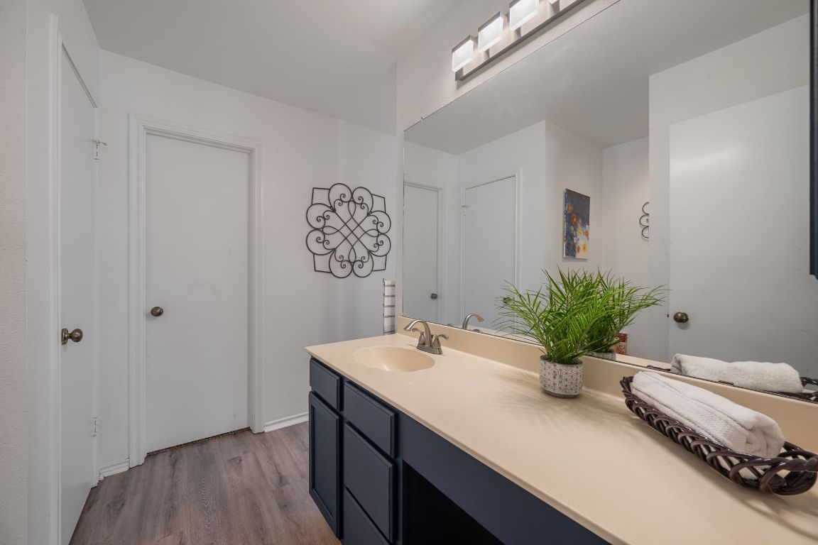 1607 Azalea Drive Cedar Park, TX 78613 - Photo 18 of 40 a bathroom with a sink and a mirror
