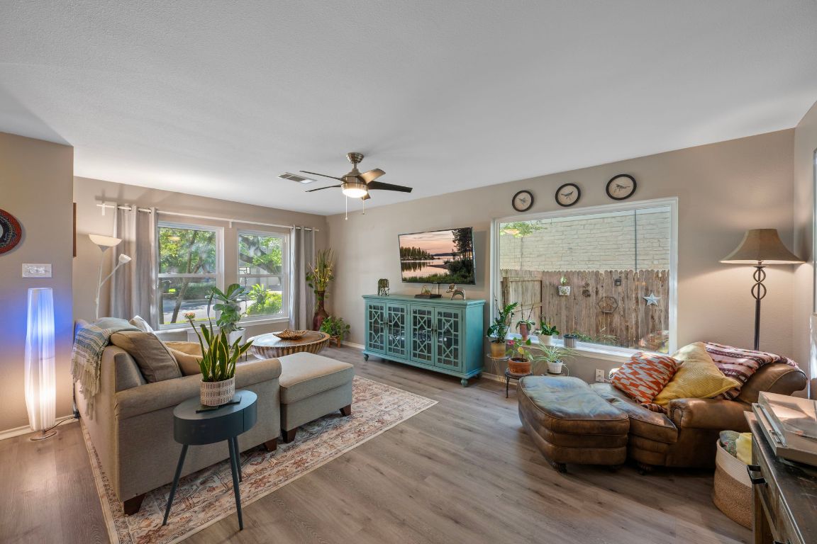 1607 Azalea Drive Cedar Park, TX 78613 - Photo 2 of 40 a living room with furniture and a flat screen tv