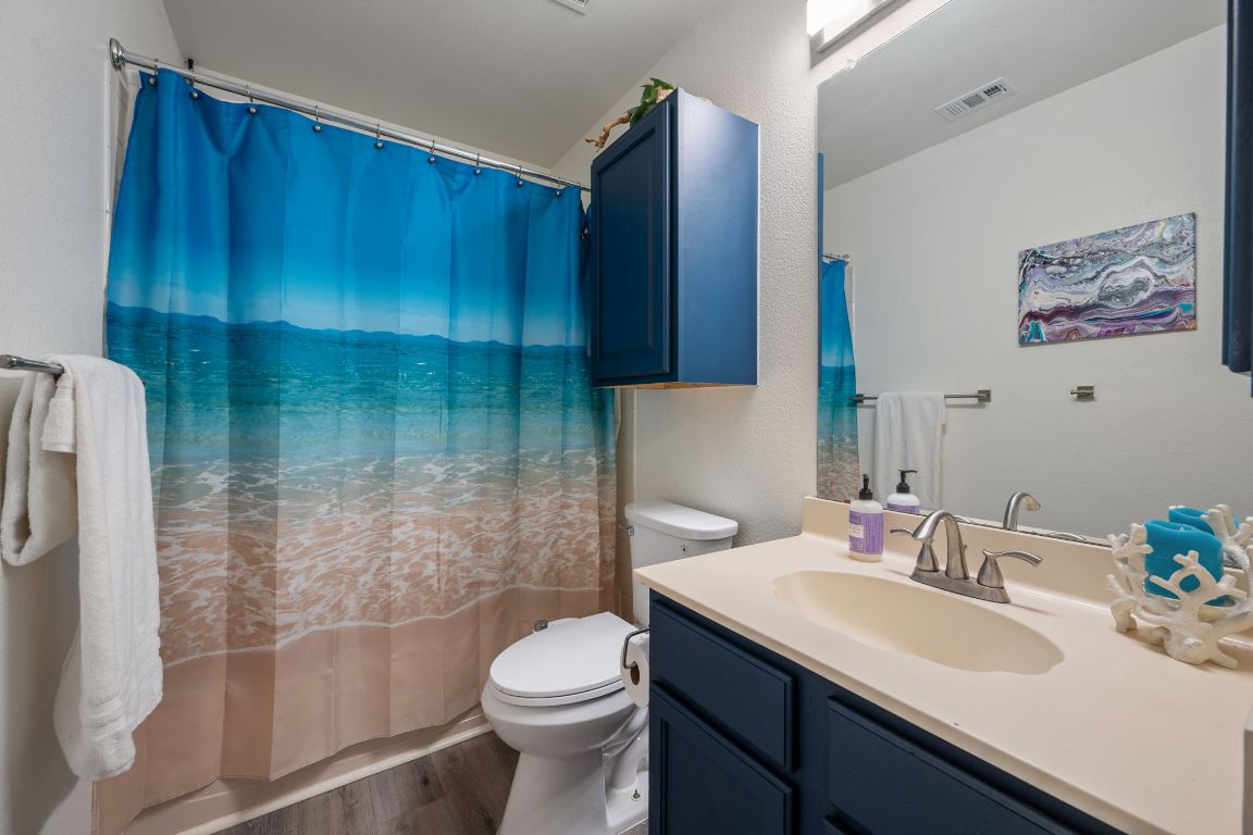 1607 Azalea Drive Cedar Park, TX 78613 - Photo 22 of 40 a bathroom with a sink a toilet and shower