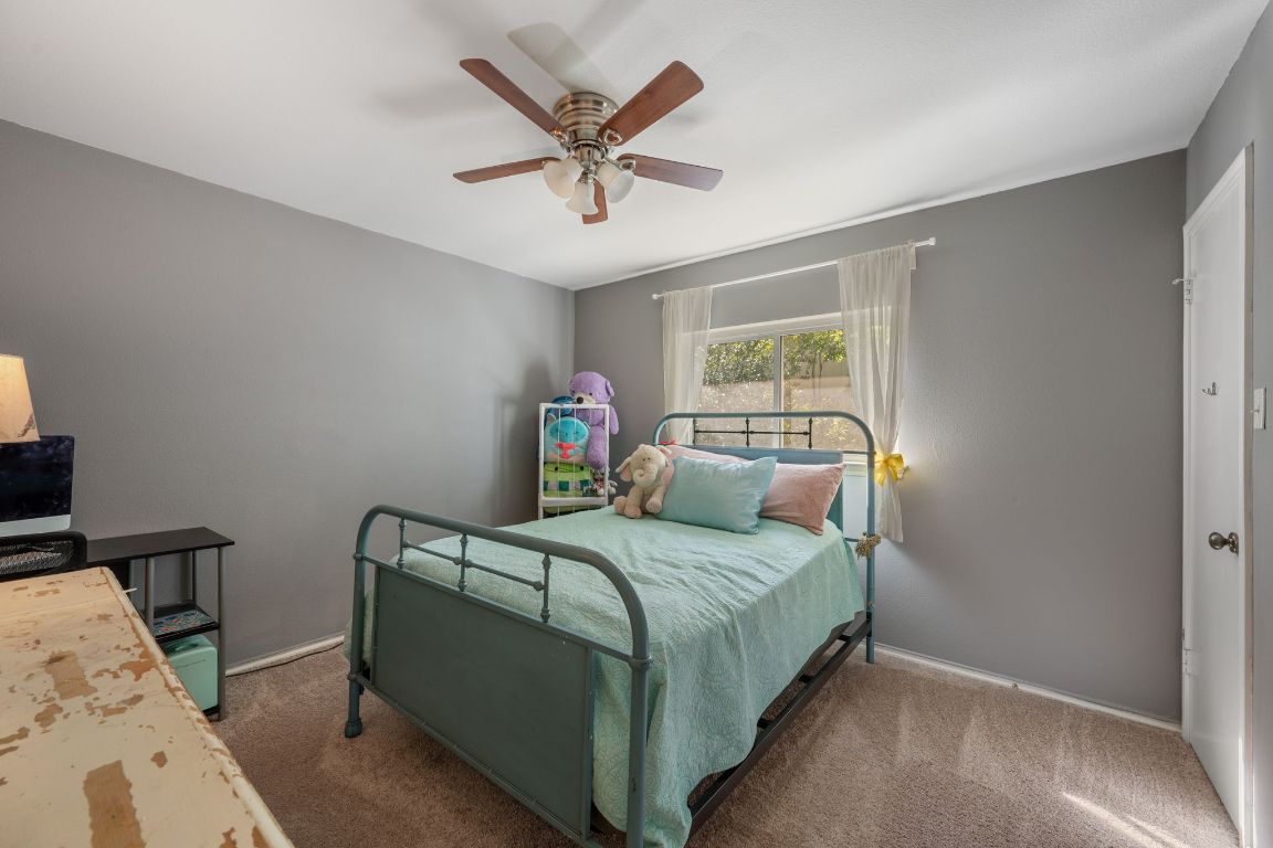 1607 Azalea Drive Cedar Park, TX 78613 - Photo 23 of 40 a bedroom with a bed and window