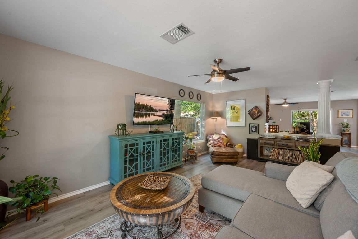 1607 Azalea Drive Cedar Park, TX 78613 - Photo 3 of 40 a living room with furniture a flat screen tv and a table