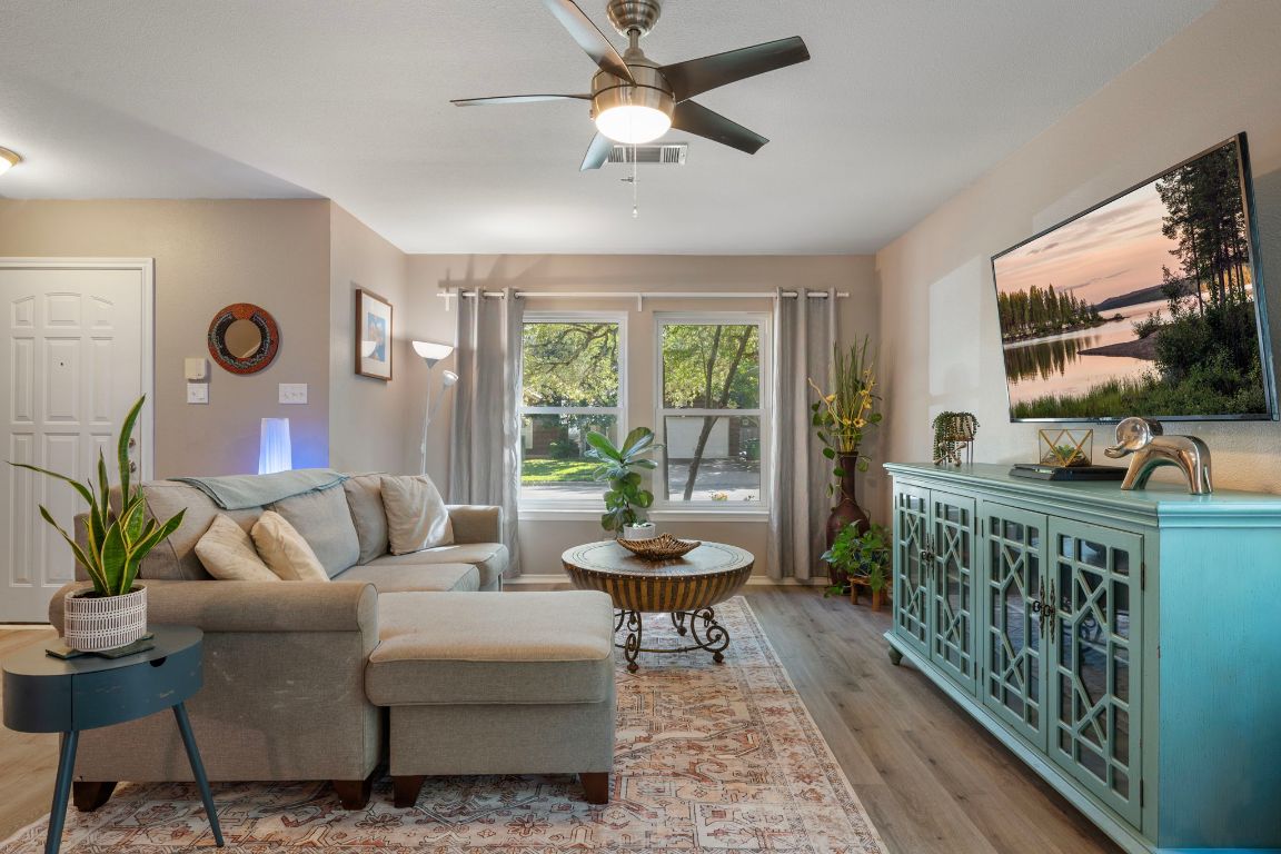 1607 Azalea Drive Cedar Park, TX 78613 - Photo 4 of 40 a living room with furniture and a flat screen tv