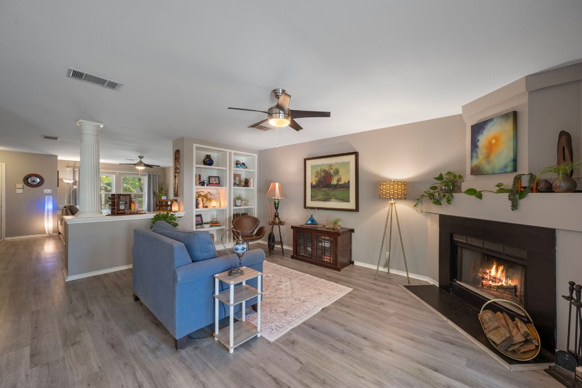 1607 Azalea Drive Cedar Park, TX 78613 - Photo 5 of 40 a living room with furniture and a fireplace