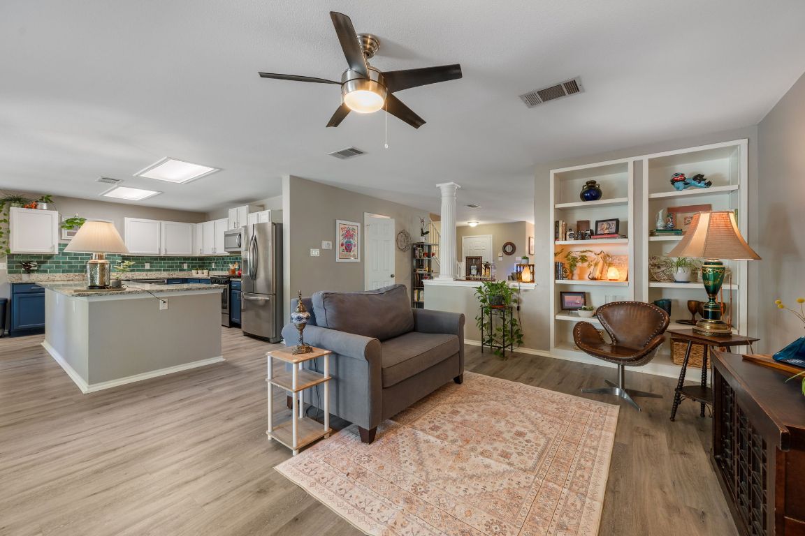 1607 Azalea Drive Cedar Park, TX 78613 - Photo 6 of 40 a living room with furniture and kitchen view