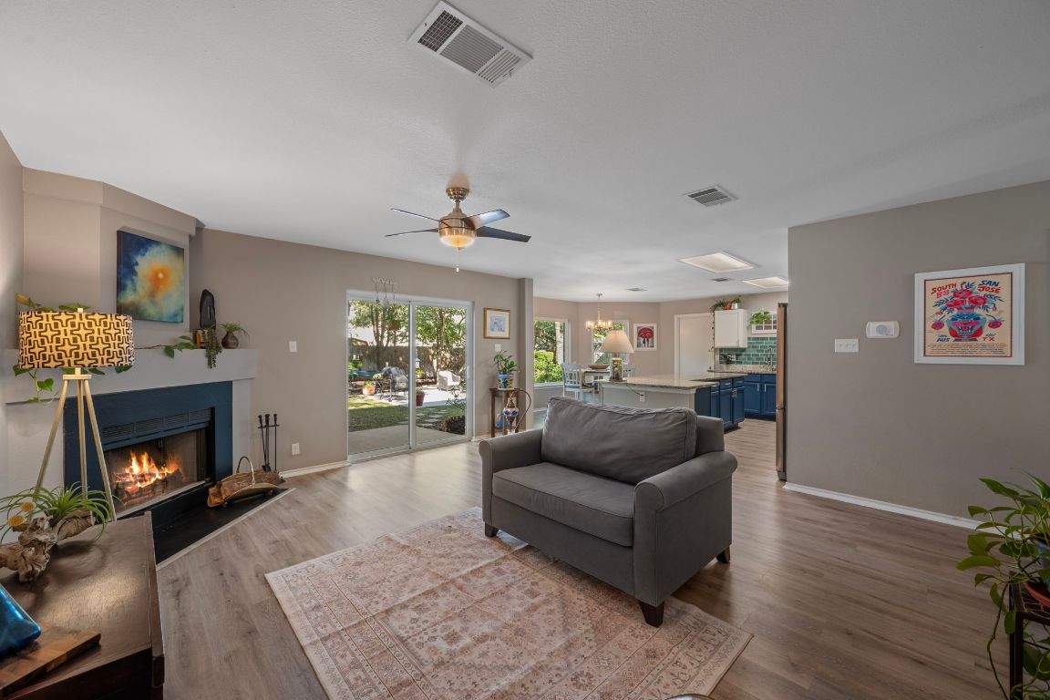 1607 Azalea Drive Cedar Park, TX 78613 - Photo 7 of 40 a living room with furniture and a fireplace