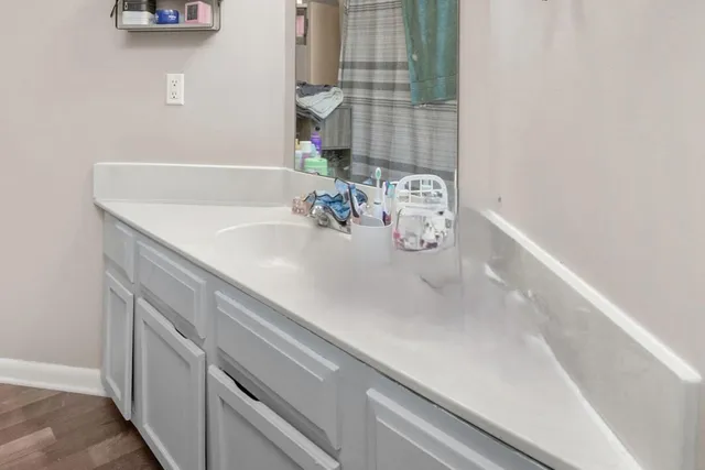 a bathroom with a sink and a mirror