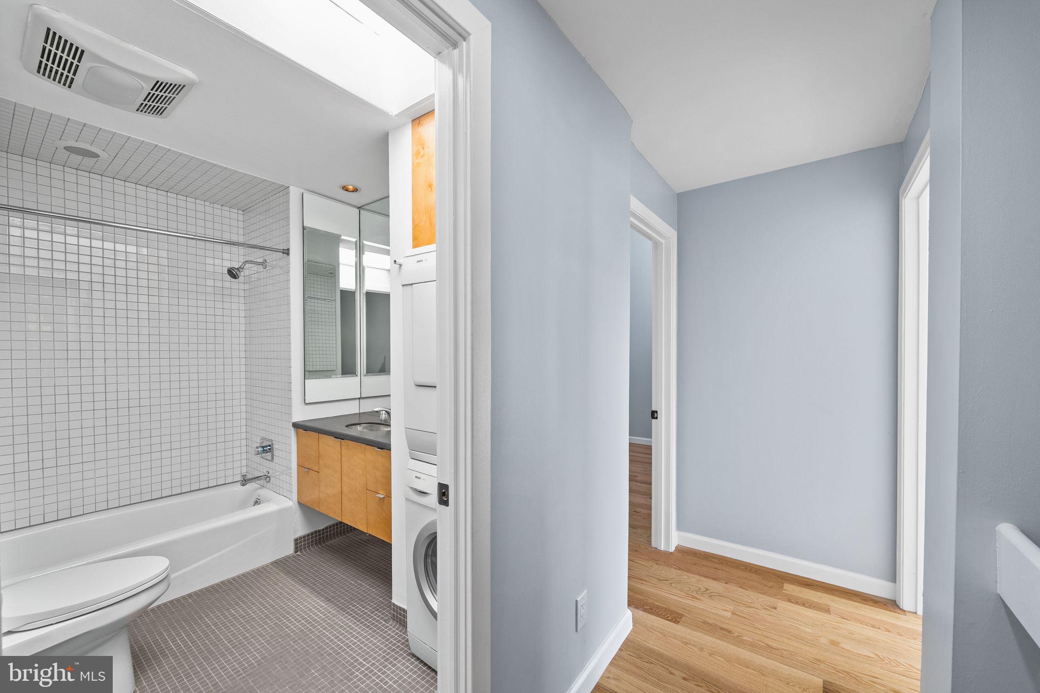 1130 Lombard Street Philadelphia, PA 19147 - Photo 29 of 45 a bathroom with a tub toilet and sink