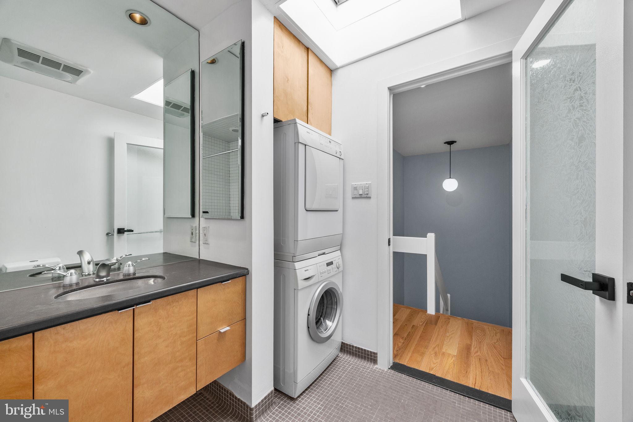 1130 Lombard Street Philadelphia, PA 19147 - Photo 31 of 45 a bathroom with a sink and a mirror