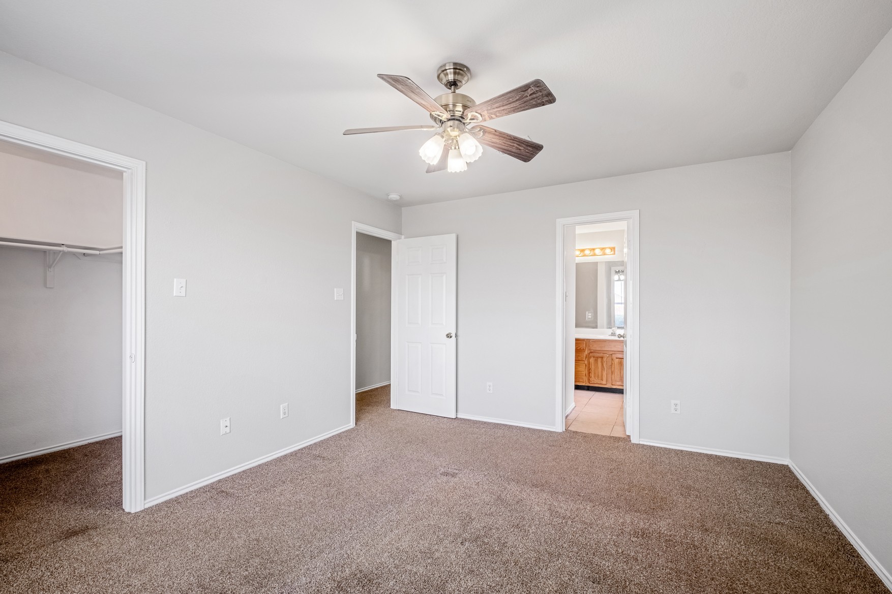 3709 Crownover Street Austin, TX 78725 - Photo 12 of 26 This room features light-colored walls and soft carpeting