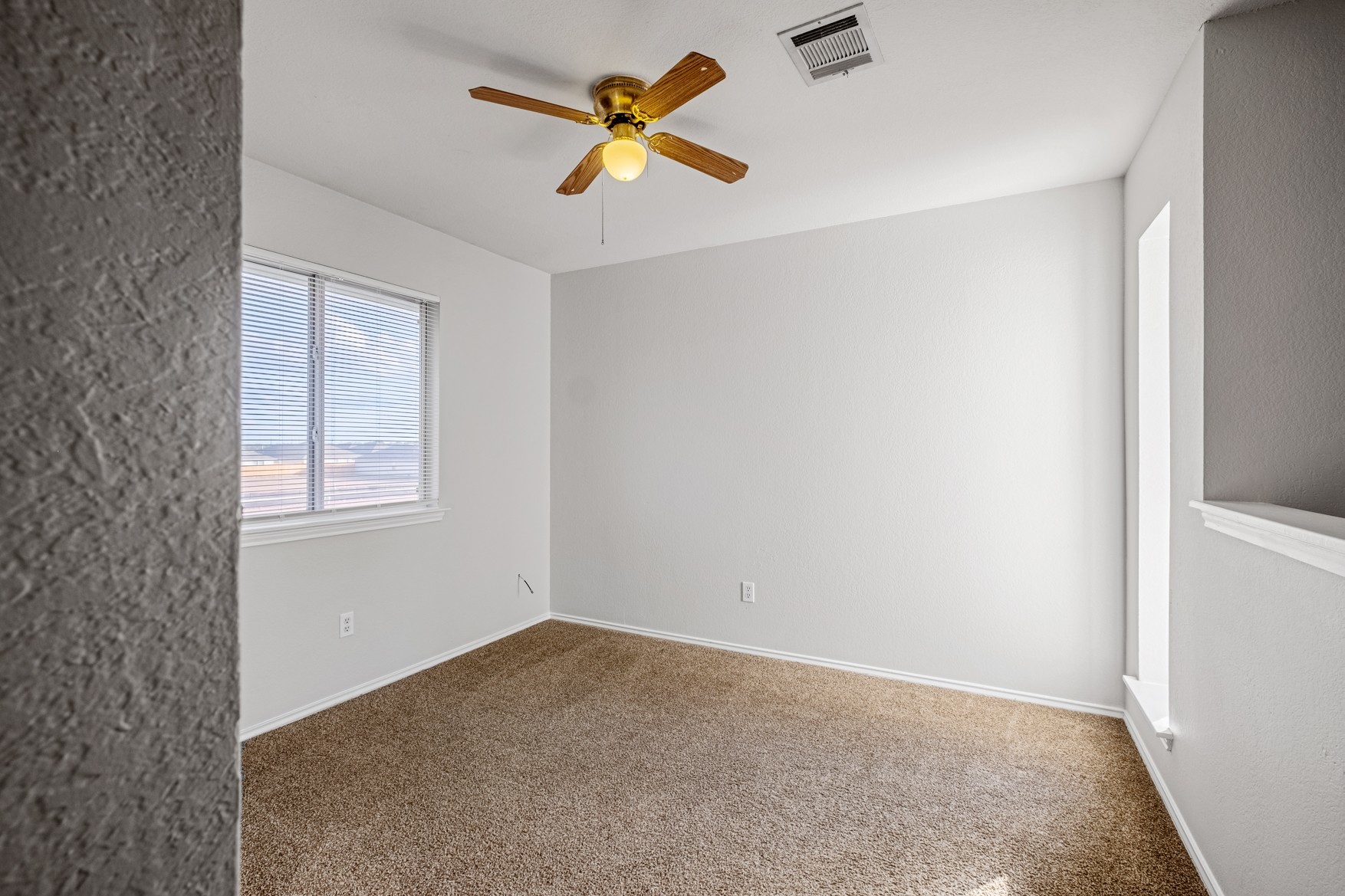 3709 Crownover Street Austin, TX 78725 - Photo 15 of 26 This room features light-colored walls, carpeted flooring, and a window with blinds
