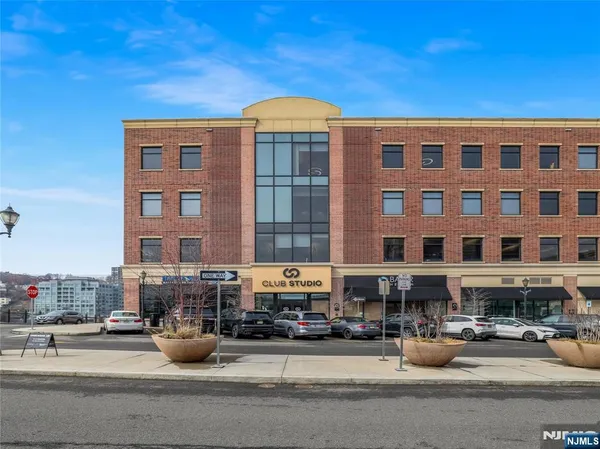 a front view of a building with street view