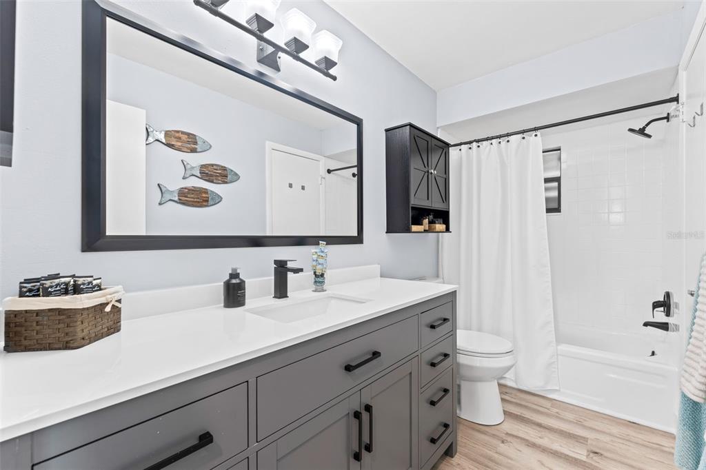 29 Pelican Lane Edgewater, FL 32141 - Photo 19 of 39 a bathroom with a tub sink and mirror