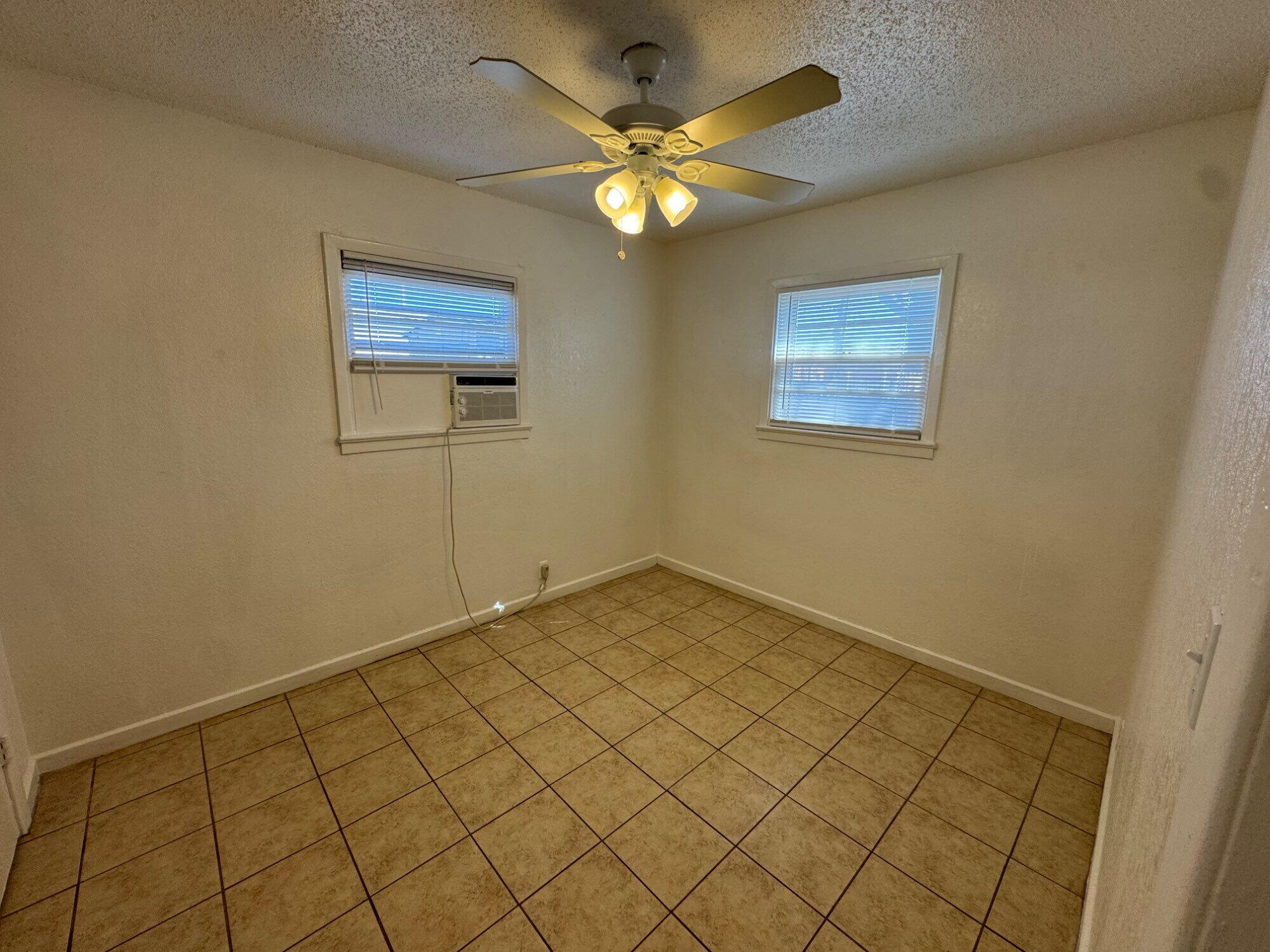 2208 35th Street, Unit B Lubbock, TX 79412 - Photo 8 of 9 a view of an empty room