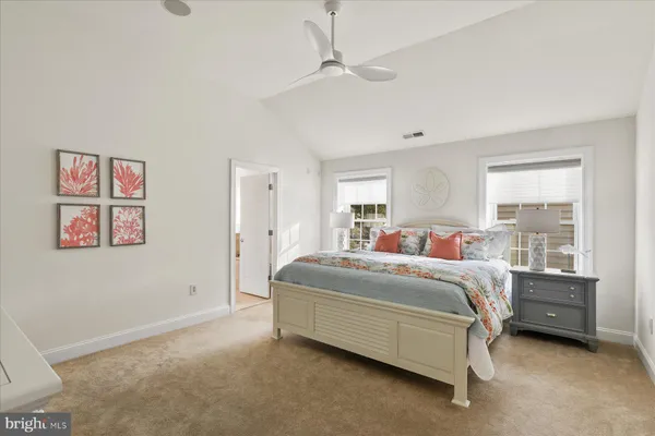 a bed room with a bed and a window