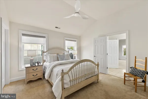 a bed room with a bed and a window