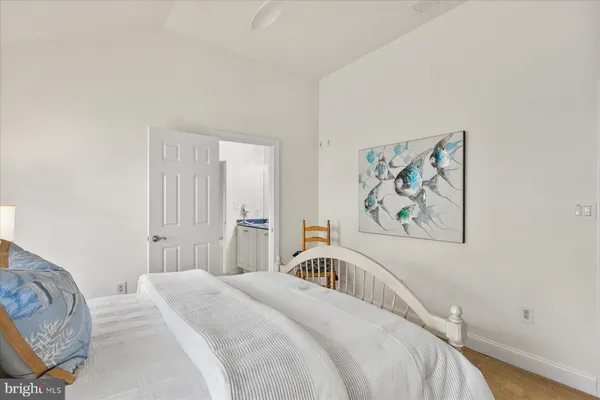 a bedroom with a large bed and a couch