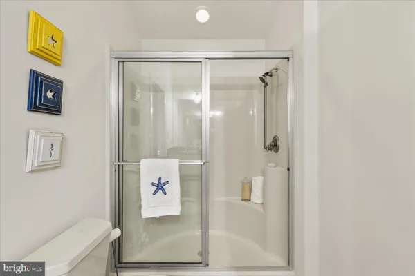 a bathroom with a shower and a sink