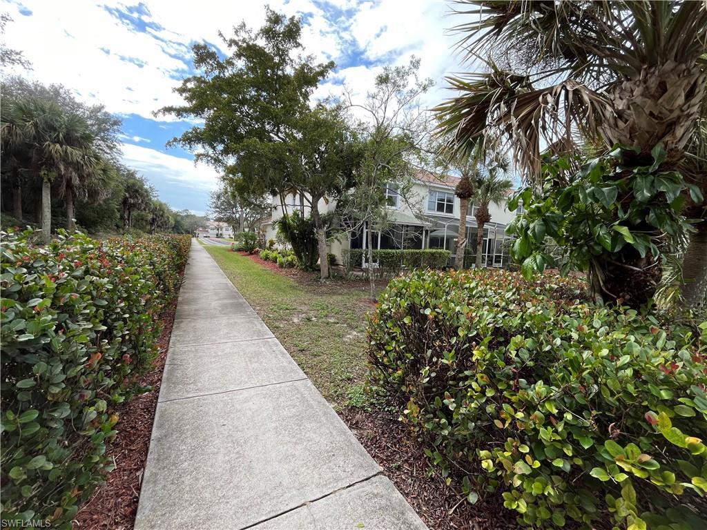 884 Hampton Circle, Unit 159 Naples, FL 34105 - Photo 27 of 28 a view of a garden with plants