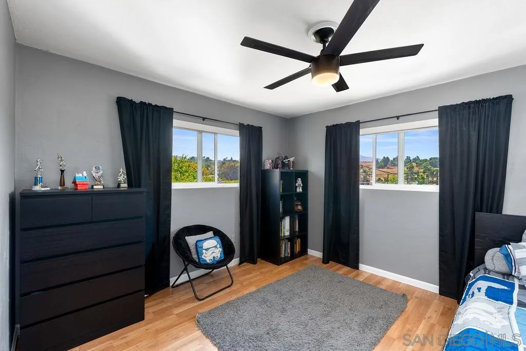 14134 Lyons Valley Road Jamul, CA 91935 - Photo 15 of 25 a bed room with a bed tv and a window