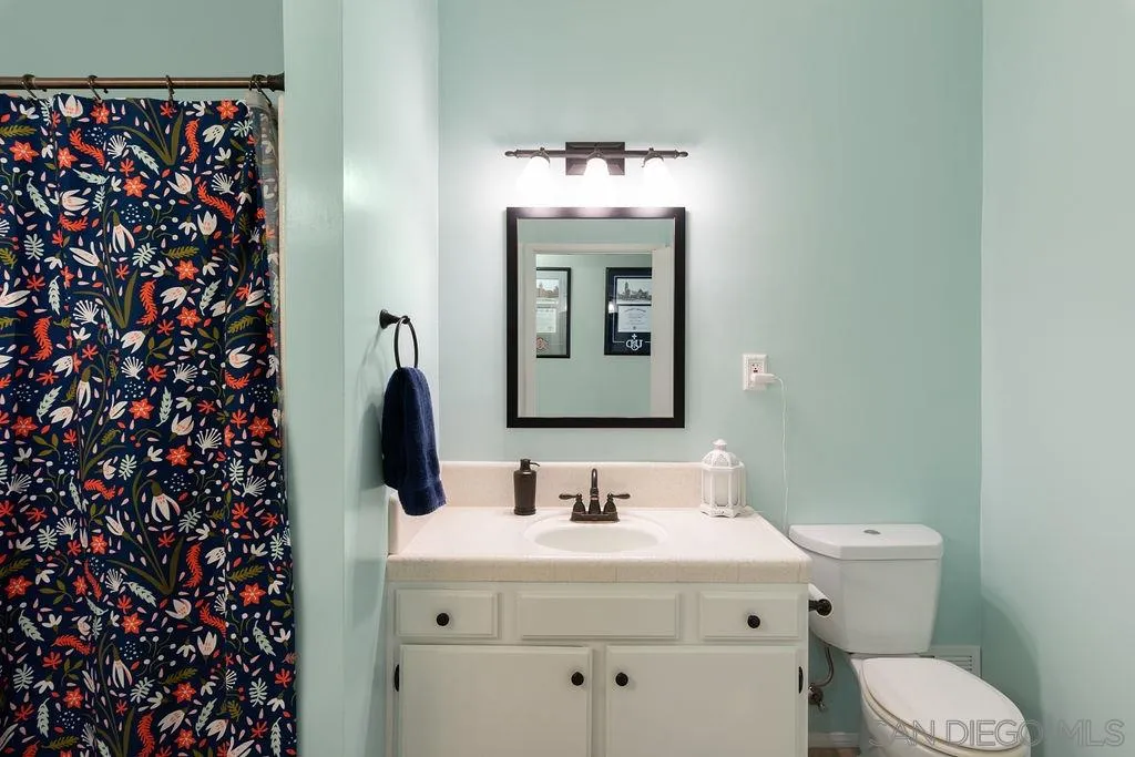 14134 Lyons Valley Road Jamul, CA 91935 - Photo 17 of 25 a bathroom with a sink and a mirror