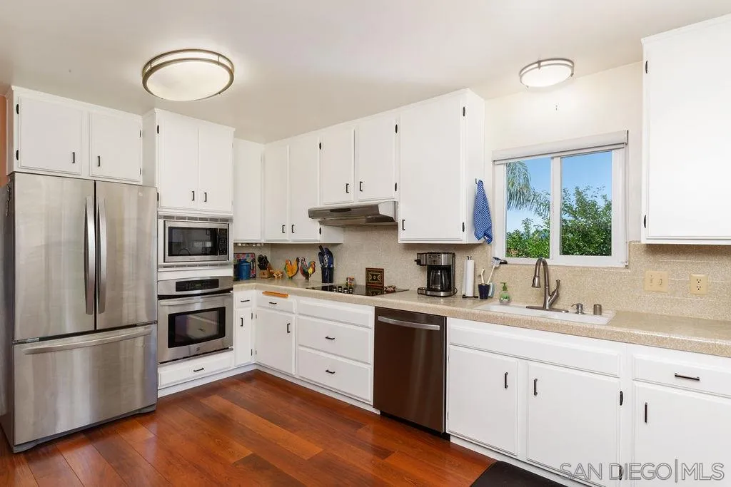 14134 Lyons Valley Road Jamul, CA 91935 - Photo 7 of 25 a kitchen with stainless steel appliances granite countertop a refrigerator sink and cabinets