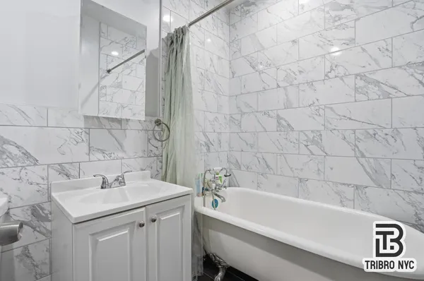 a bathroom with a sink and a bathtub