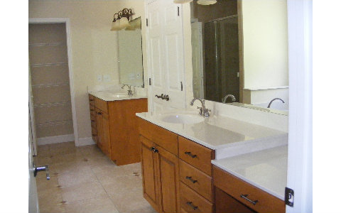 96103 Captains Pointe Road Yulee, FL 32097 - Photo 12 of 14 a bathroom with a sink double vanity and a mirror