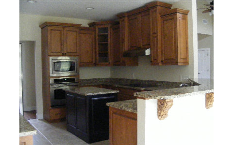 96103 Captains Pointe Road Yulee, FL 32097 - Photo 4 of 14 a kitchen with granite countertop a stove top oven a sink and dishwasher