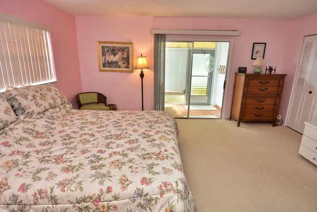 a bedroom with a bed and with furniture