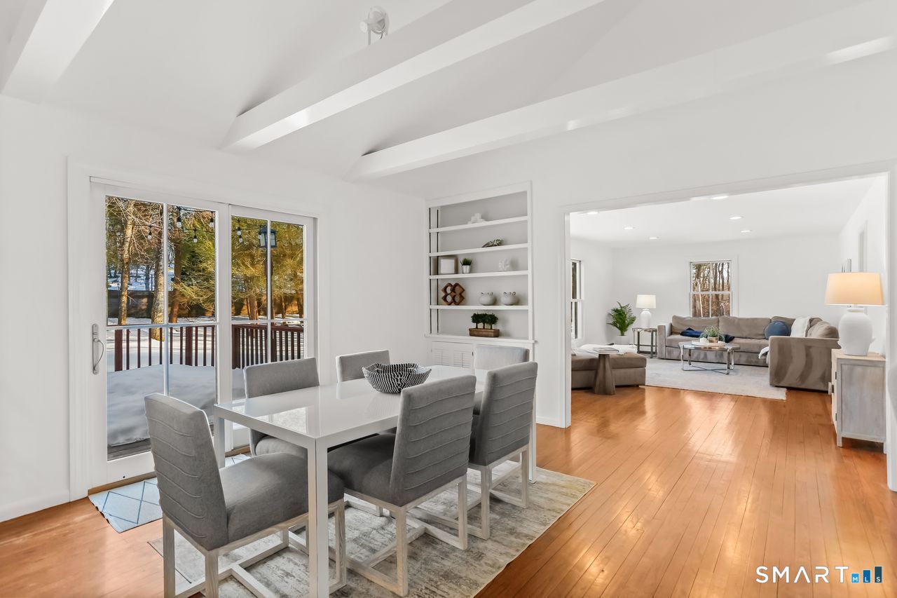 103 Davis Hill Road Weston, CT 06883 - Photo 13 of 37 a view of a dining room with furniture window and wooden floor