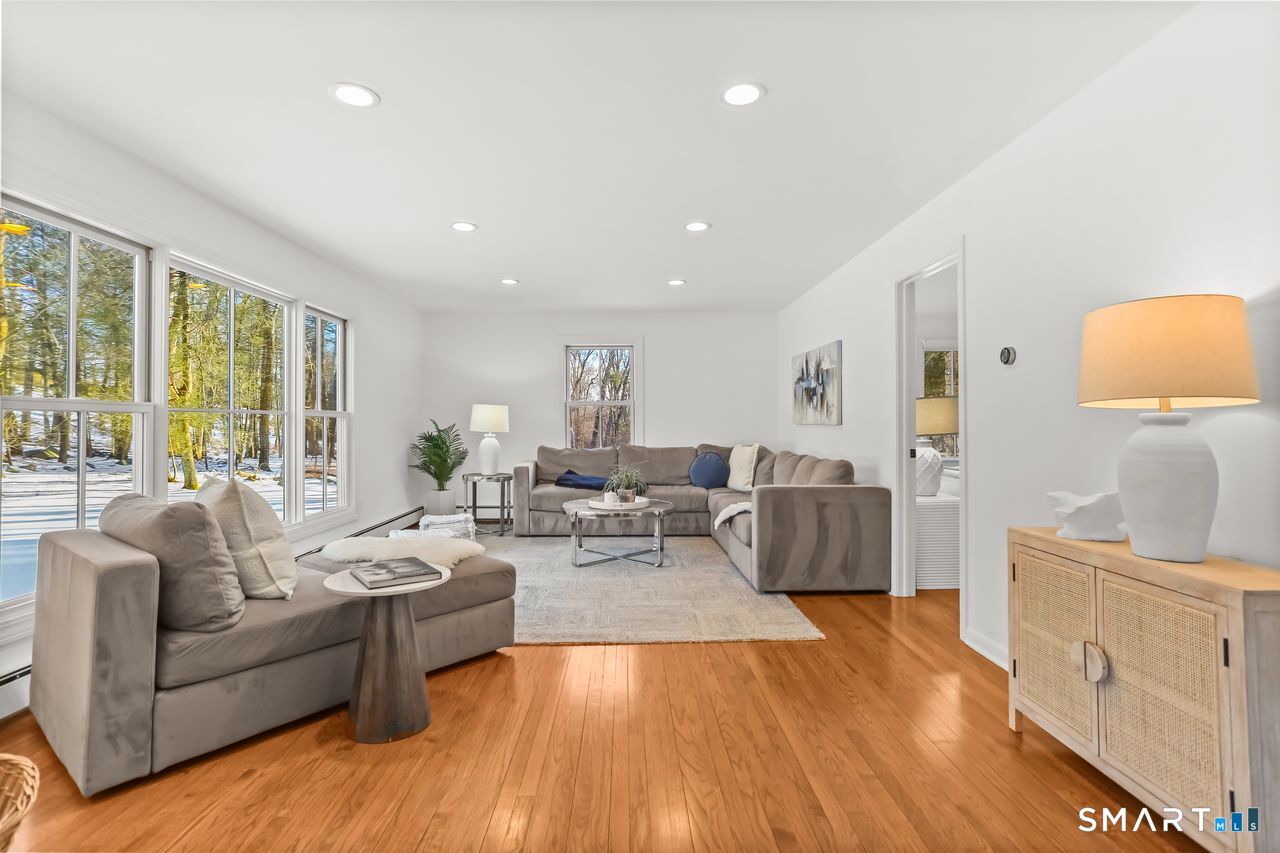 103 Davis Hill Road Weston, CT 06883 - Photo 14 of 37 a living room with furniture and a large window