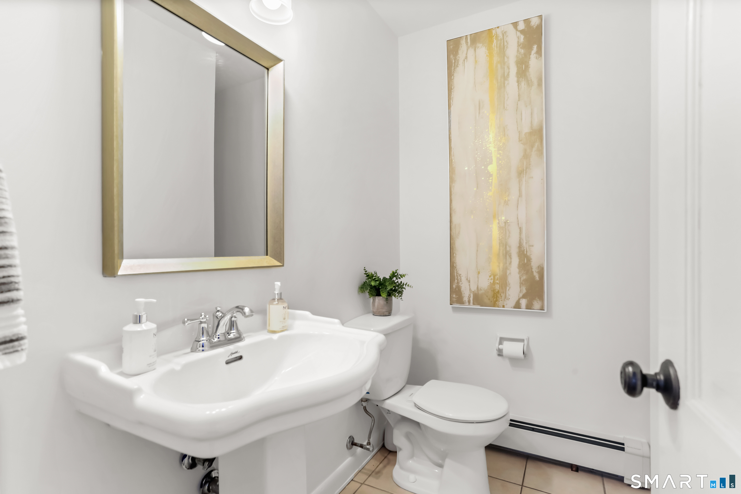 103 Davis Hill Road Weston, CT 06883 - Photo 18 of 37 a bathroom with a sink toilet and a mirror