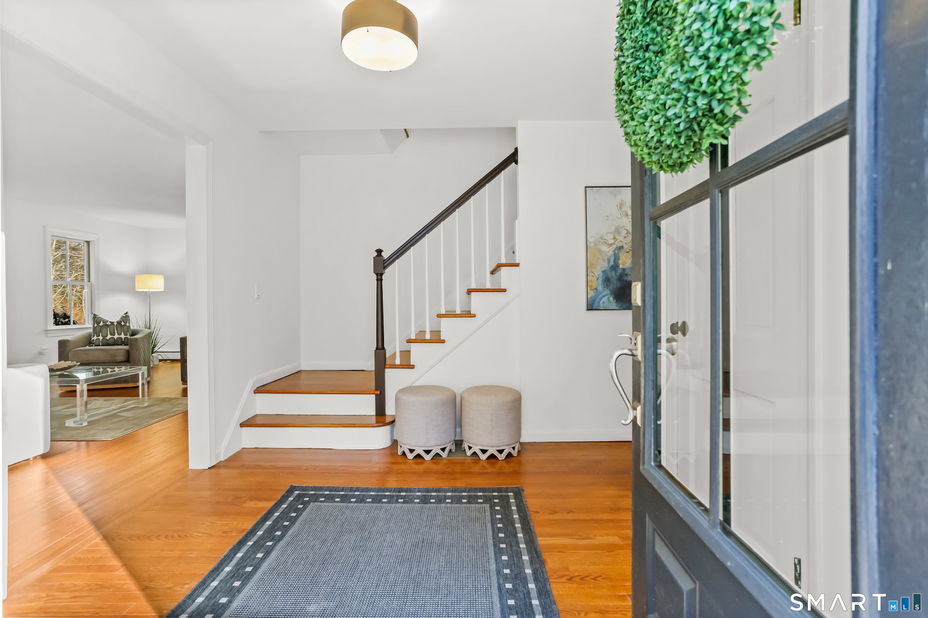 103 Davis Hill Road Weston, CT 06883 - Photo 19 of 37 a view of entryway and hall with wooden floor