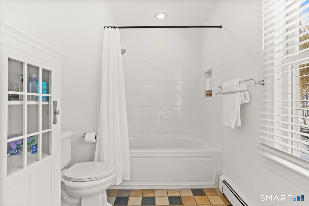 103 Davis Hill Road Weston, CT 06883 - Photo 27 of 37 a bathroom with a toilet and a shower