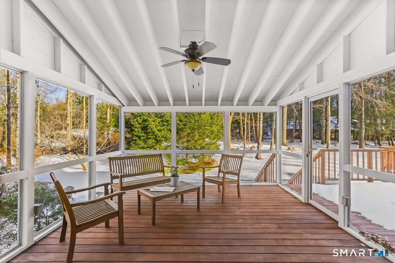 103 Davis Hill Road Weston, CT 06883 - Photo 28 of 37 a view of a dining room with furniture wooden floor and chandelier