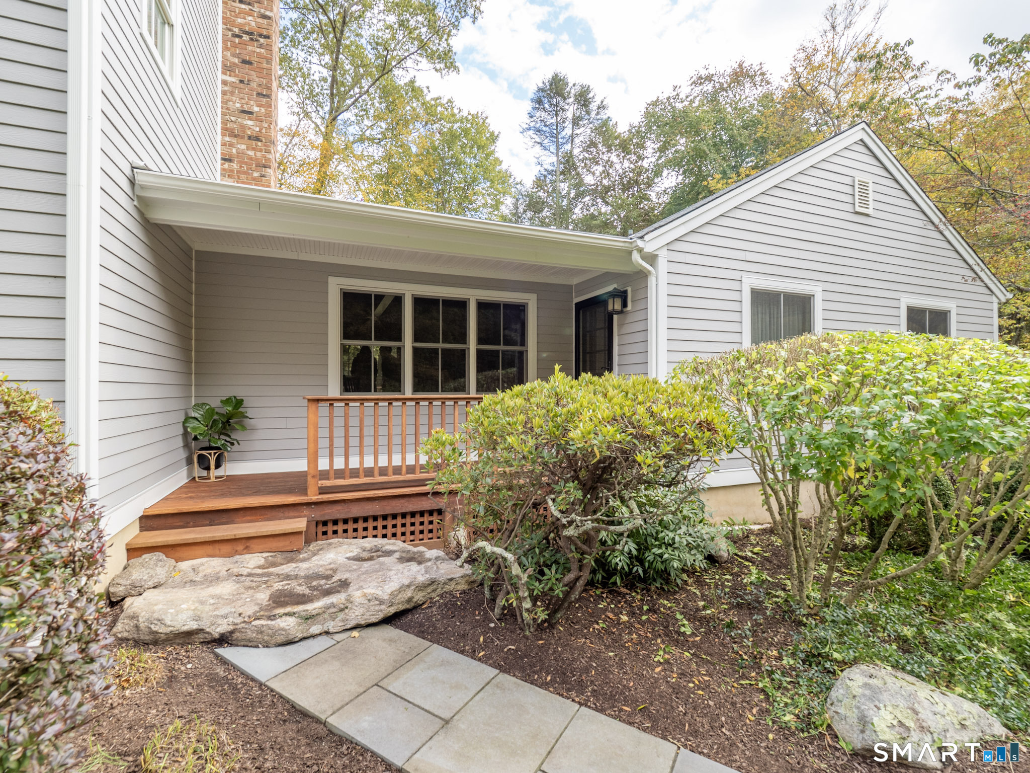 103 Davis Hill Road Weston, CT 06883 - Photo 31 of 37 a front view of a house with garden
