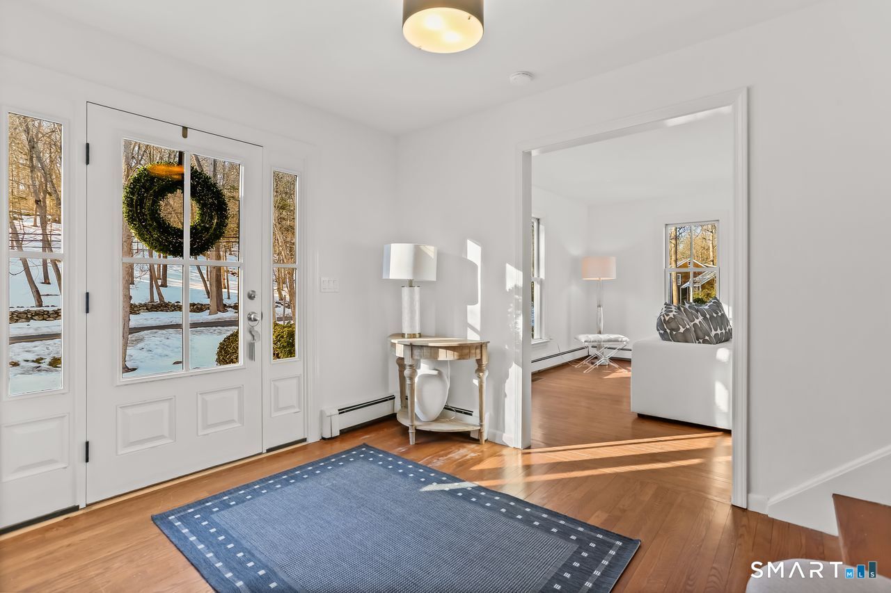 103 Davis Hill Road Weston, CT 06883 - Photo 4 of 37 a view of a living room and a window