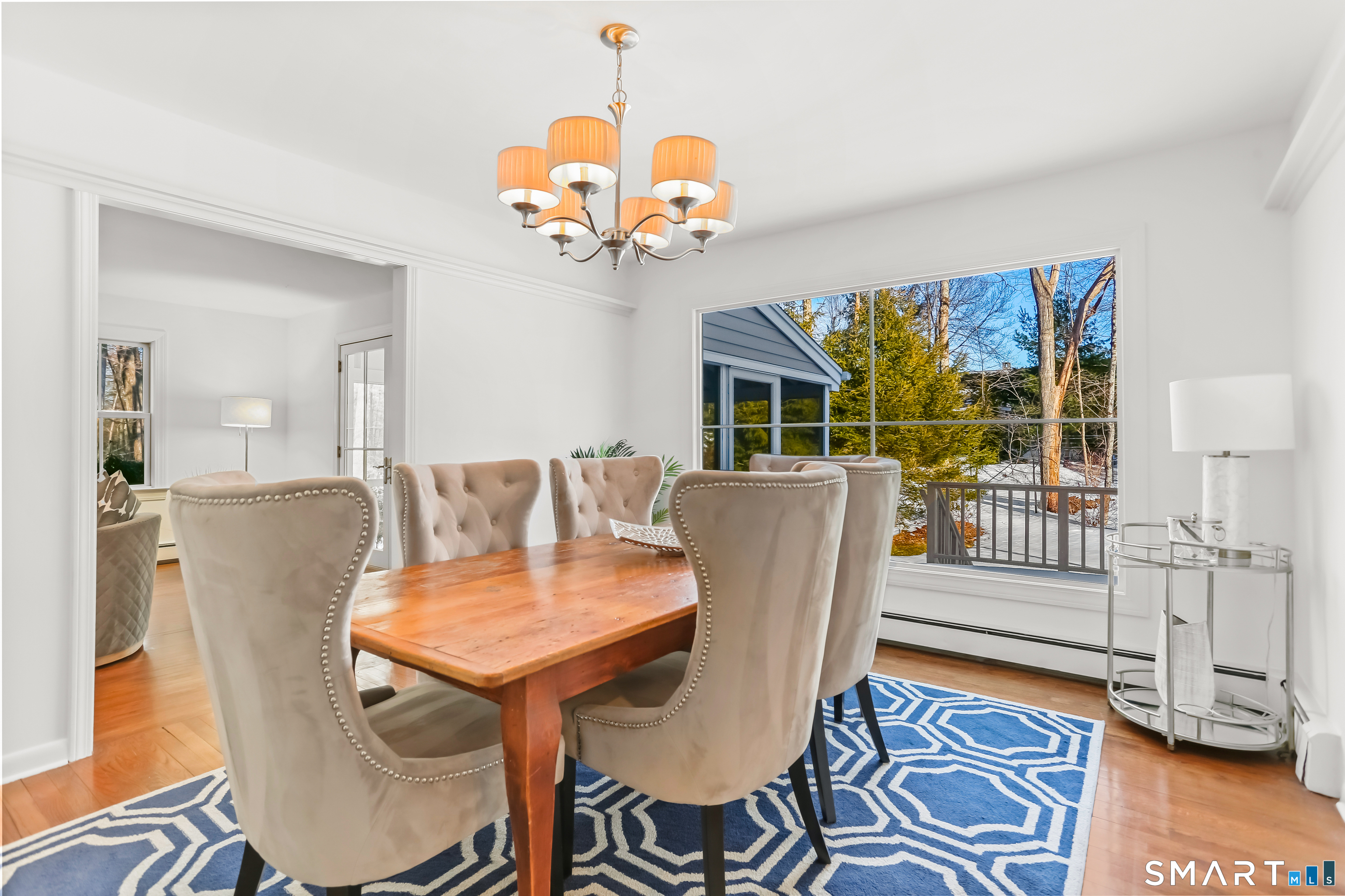 103 Davis Hill Road Weston, CT 06883 - Photo 7 of 37 a view of a dining room with furniture wooden floor and chandelier