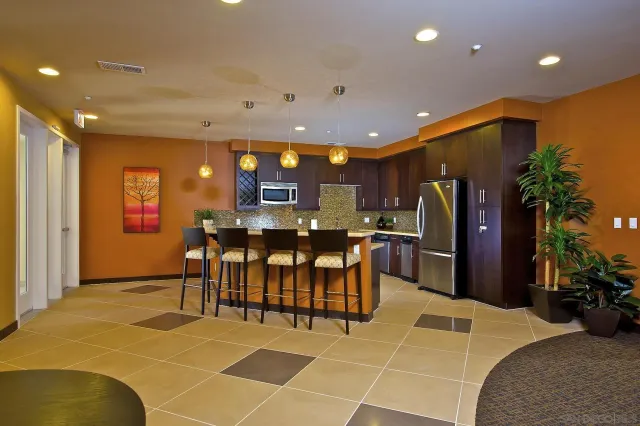a view of a patio with a dining table and chairs with wooden floor