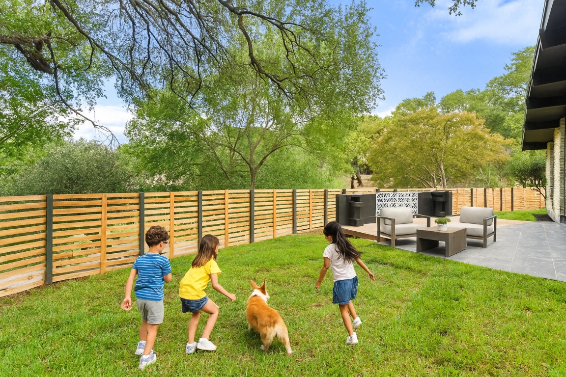 3403 Cascadera Drive Austin, TX 78731 - Photo 33 of 38 Fence recently installed adding privacy and plenty of space for gatherings, kids and pets!