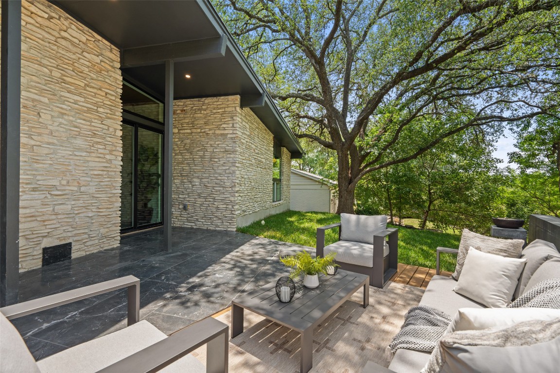 3403 Cascadera Drive Austin, TX 78731 - Photo 35 of 38 a view of backyard of a house with outdoor seating