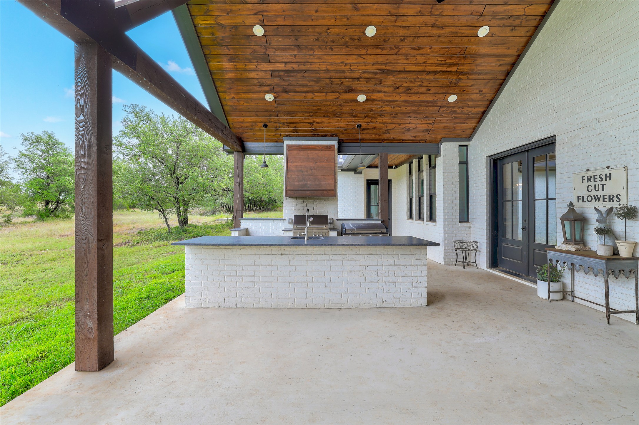 7670 Shiny Top Ranch Lane Salado, TX 76571 - Photo 32 of 40 a view of a patio with a table and chairs