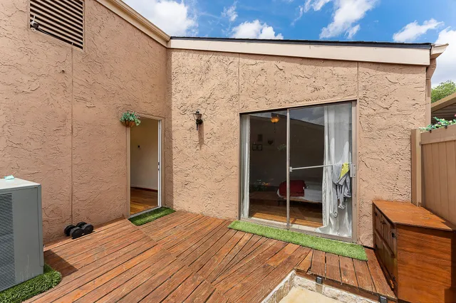 a view of outdoor space with deck and living room