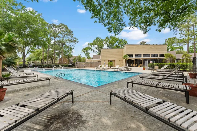 a view of a patio with a bench