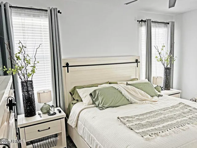 a bedroom with a bed and a window