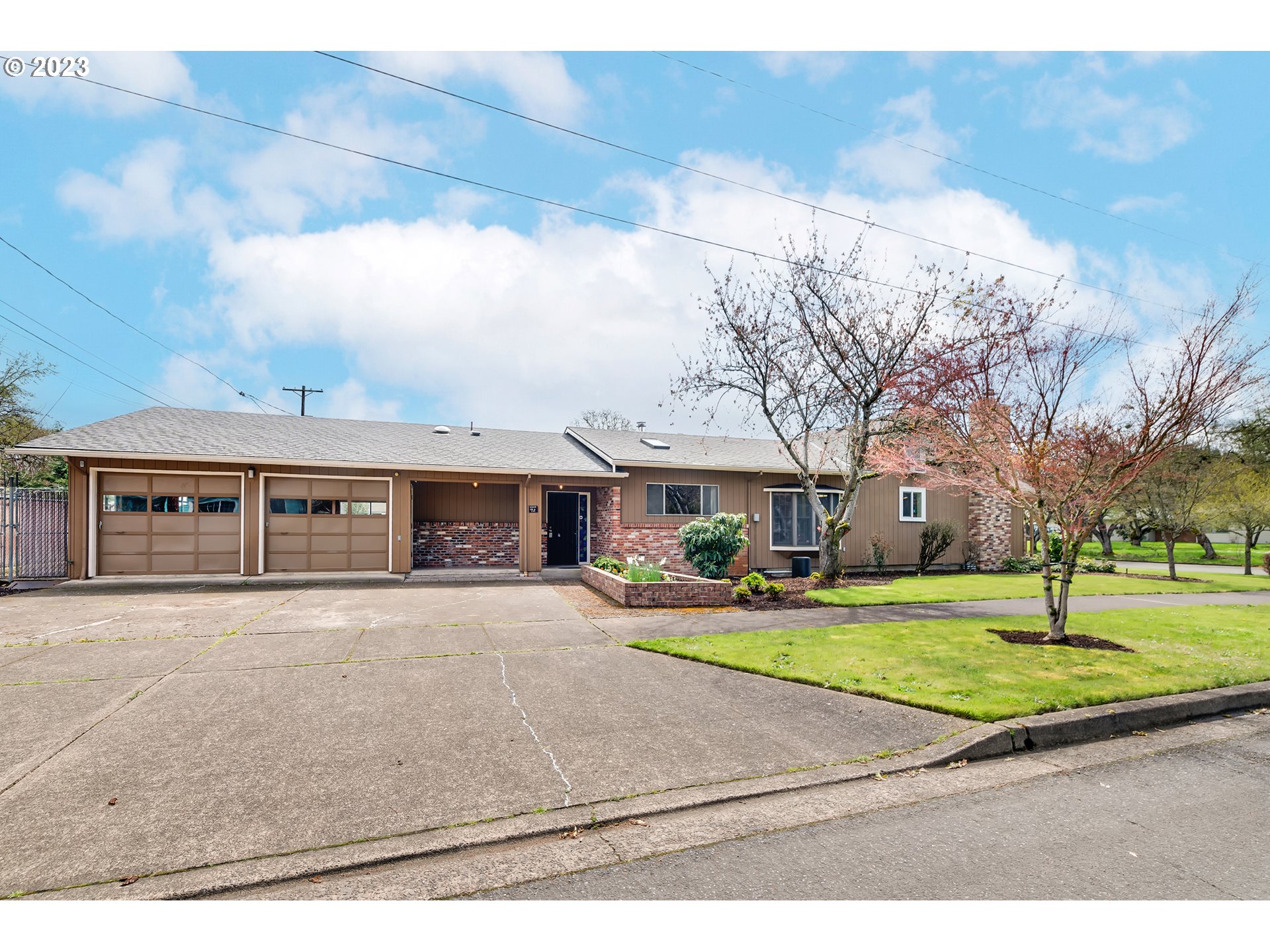 176 West C Street Springfield, OR 97477 - Photo 1 of 42 a front view of house with yard and green space